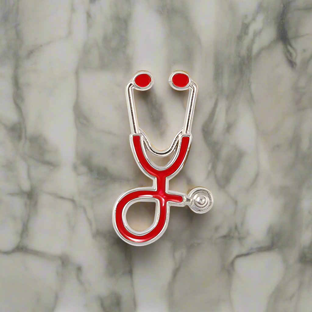 Close-up of the stethoscope lapel pin on a suit jacket, emphasizing its unique design.