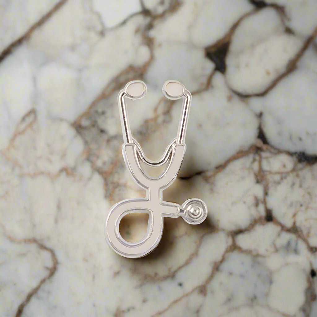 Healthcare professional wearing a stethoscope pin at a medical conference, showcasing dedication.