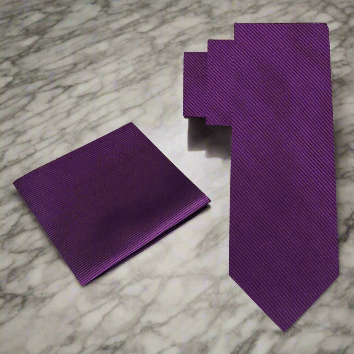 Bright red silk necktie paired with a white dress shirt for a sophisticated look.