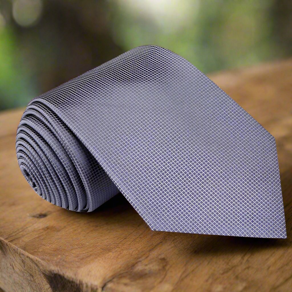 A man wearing a white dress shirt and solid red silk tie for a business or wedding event