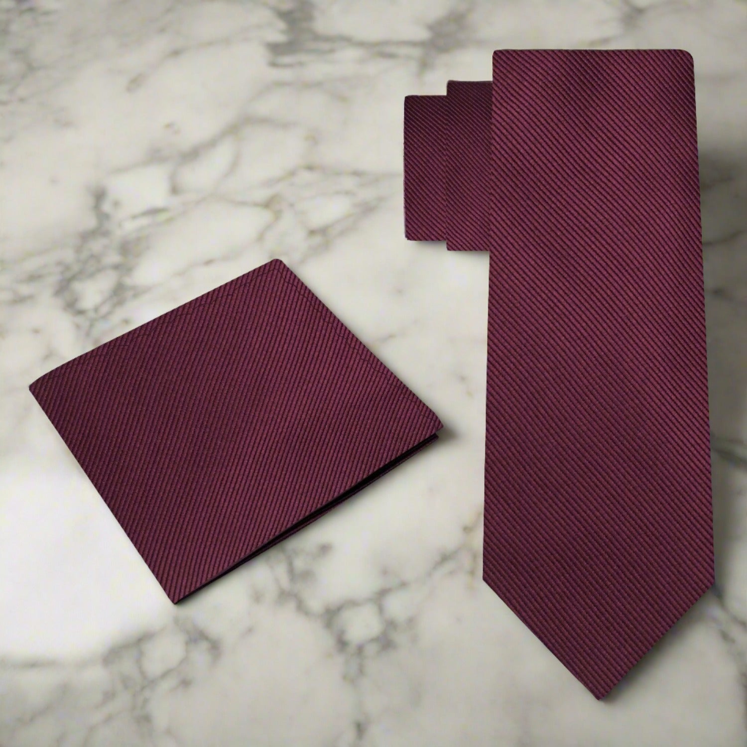 Bright red silk necktie paired with a white dress shirt for a sophisticated look.