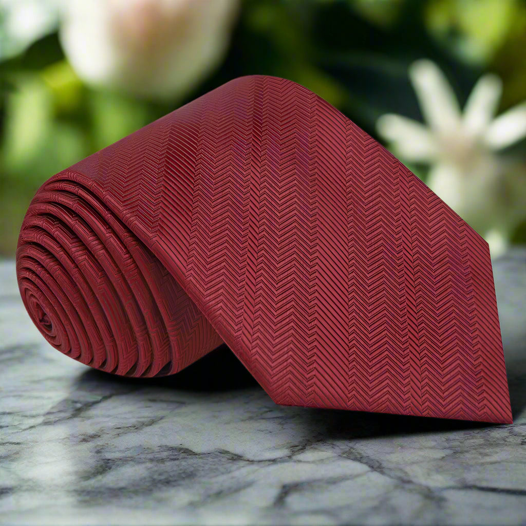 Close-up view of the Elegant Garnet Red Silk Necktie showcasing the herringbone texture.