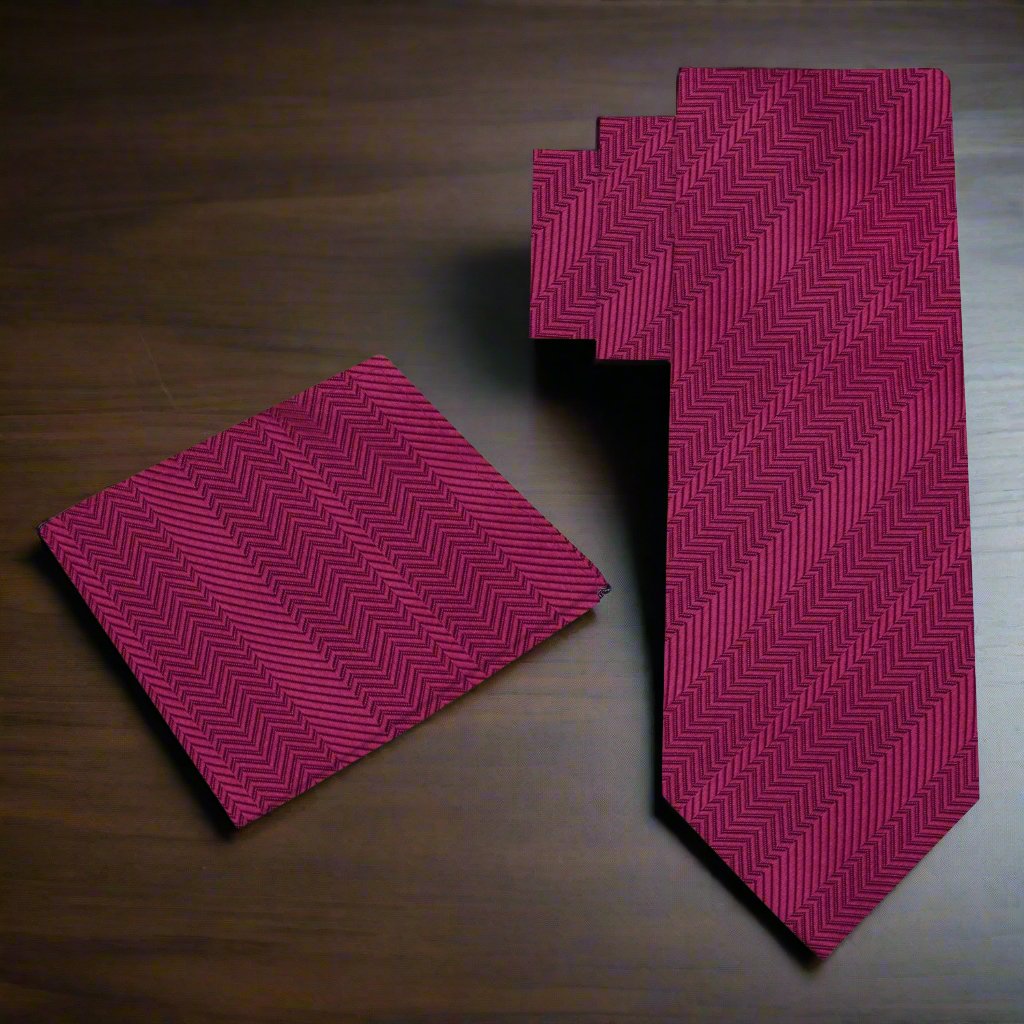 Elegant Garnet Red Silk Necktie displayed with a white dress shirt and charcoal grey suit.