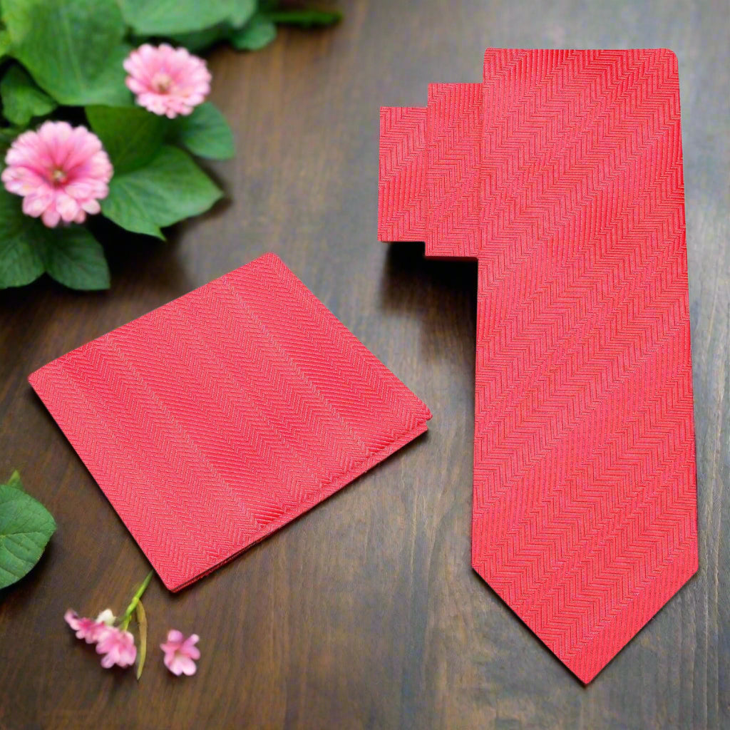 Elegant Garnet Red Silk Necktie displayed with a white dress shirt and charcoal grey suit.