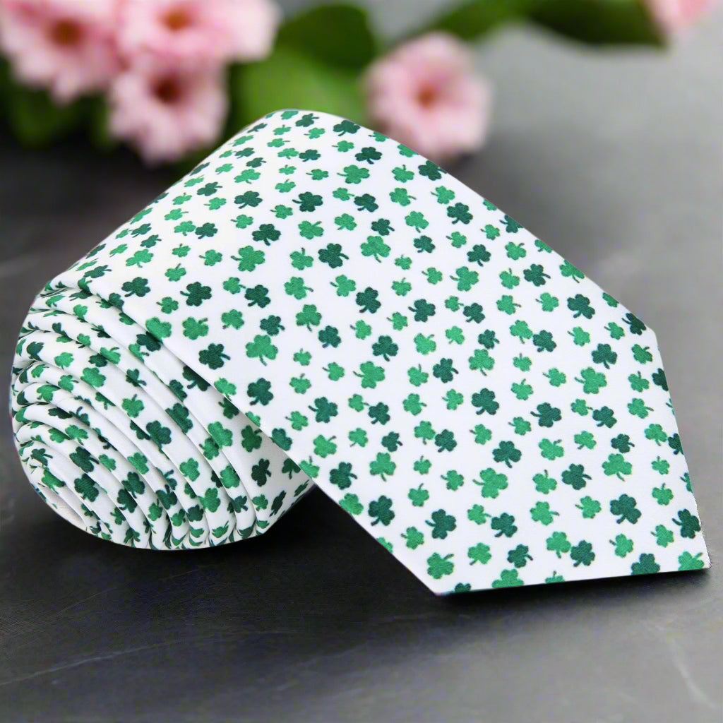 Close-up of the Irish Pride Green Clover Silk Tie showcasing its festive green and white pattern.
