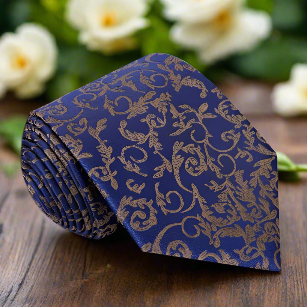 Close-up of dark blue silk necktie featuring intricate vine details.