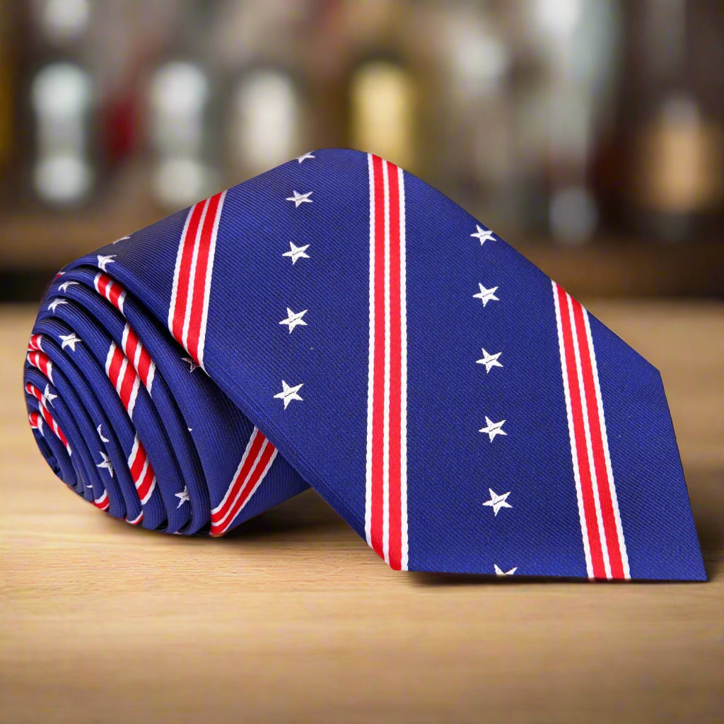 Stars and Stripes Patriotic Necktie displayed on a wooden surface, showcasing its vibrant colors and design.