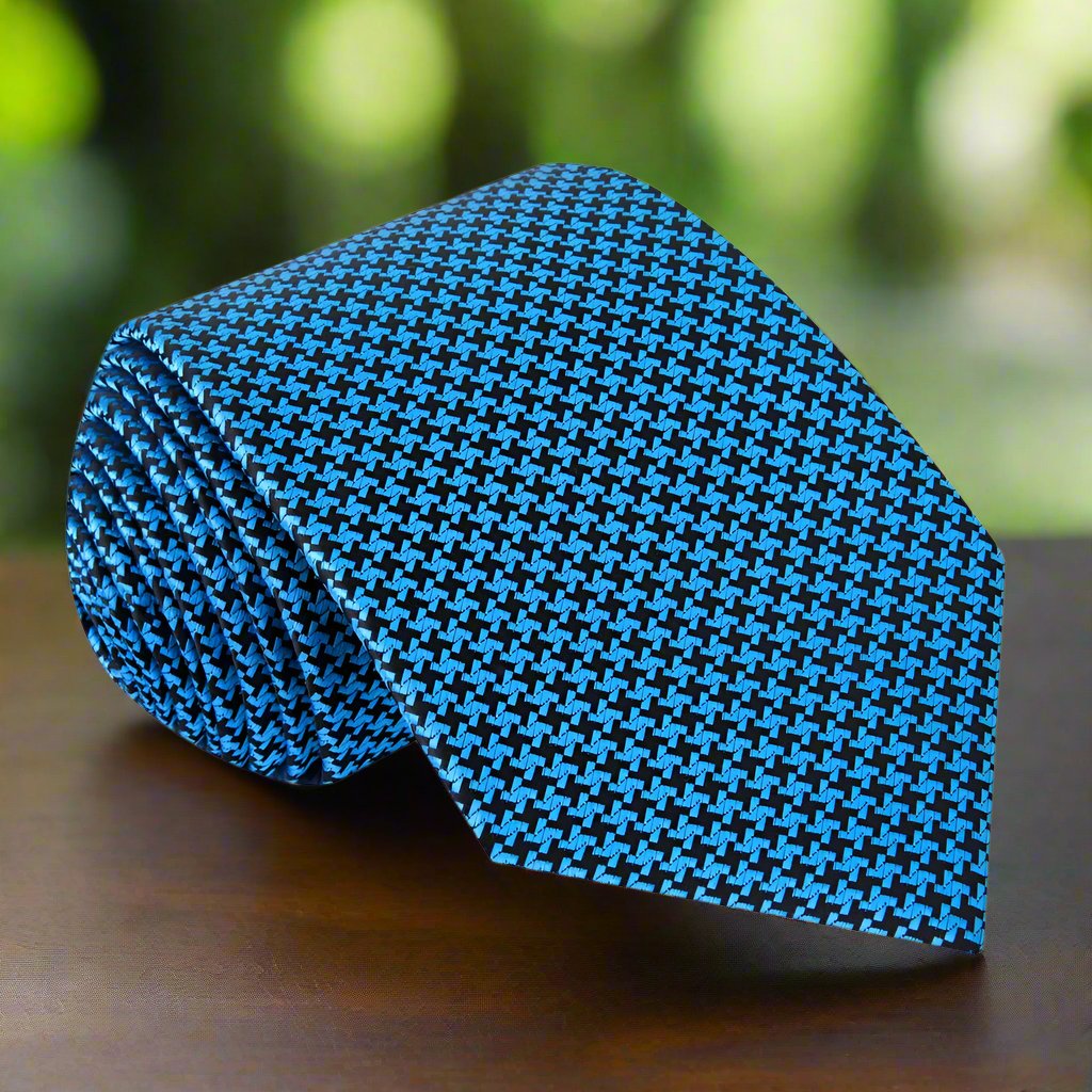 Man wearing the elegant silk necktie with a dark suit for a formal event