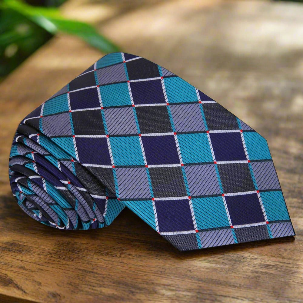 Man adjusting his formal silk tie with coordinating pocket square for wedding attire