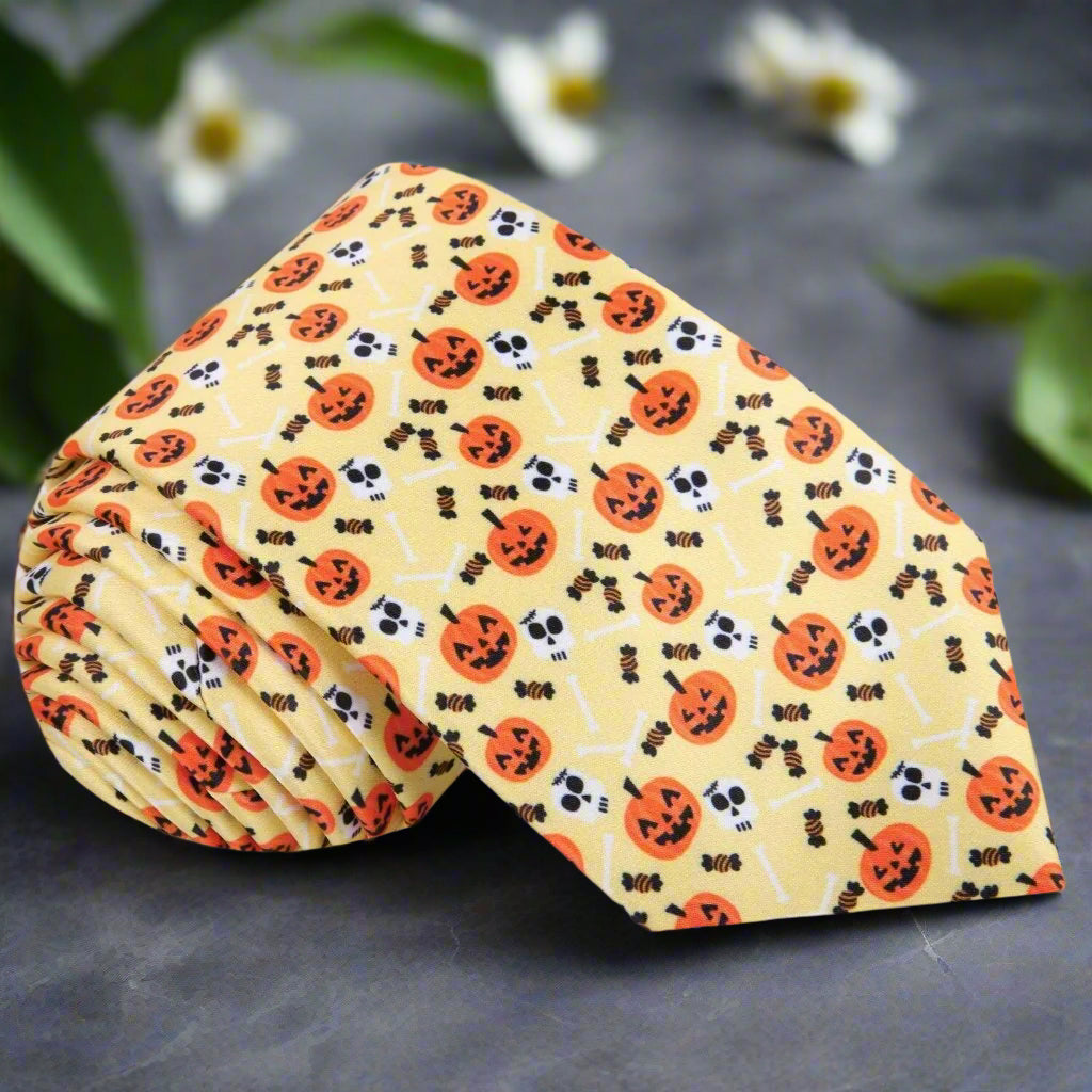 Close-up of Halloween jack-o'-lantern themed necktie with vibrant orange and black pattern