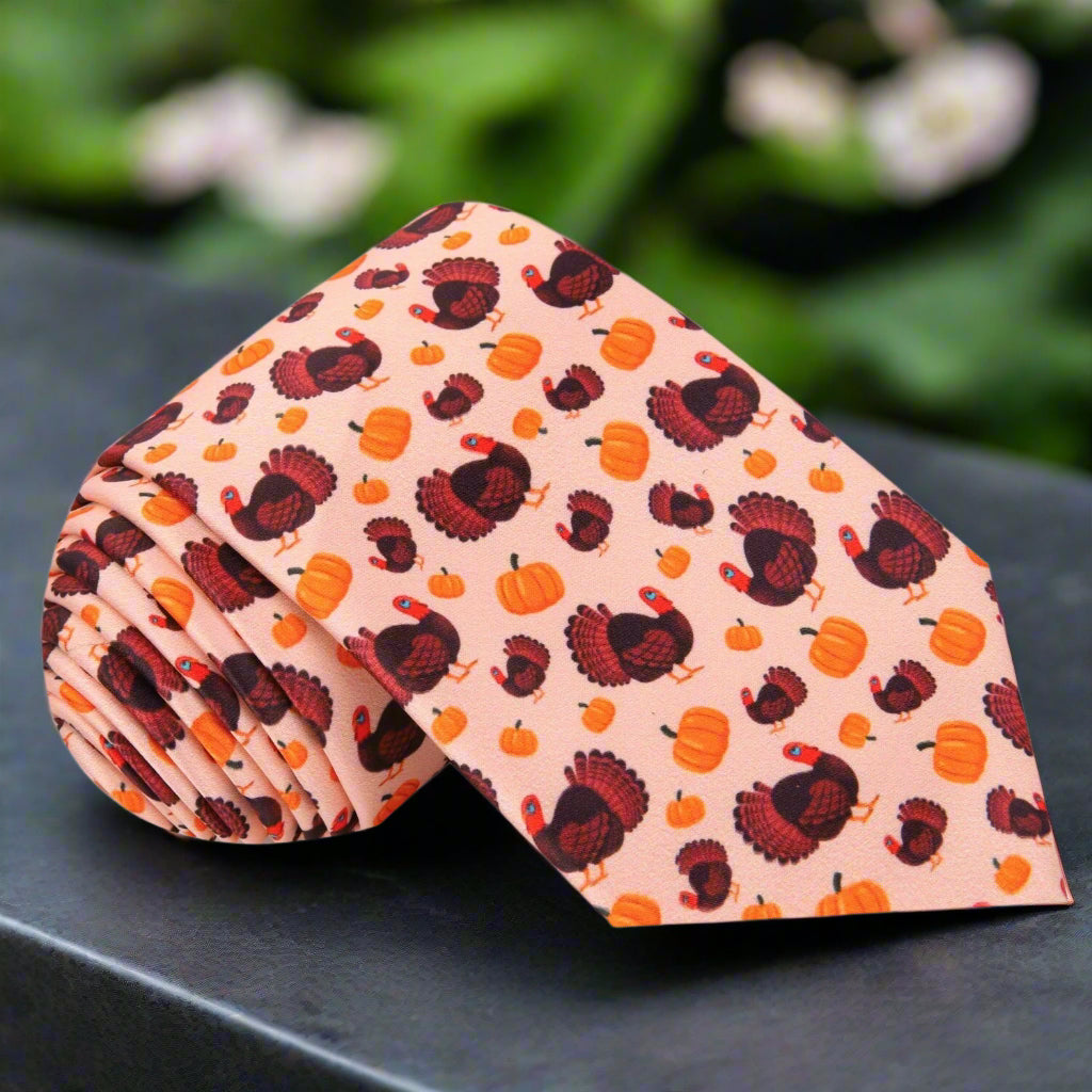 Close-up of the festive turkey necktie showcasing the vibrant turkeys and pumpkins design.