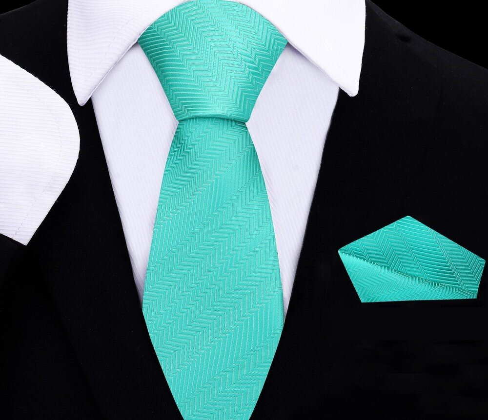 Close-up of kids turquoise bow tie worn by a boy at a wedding
