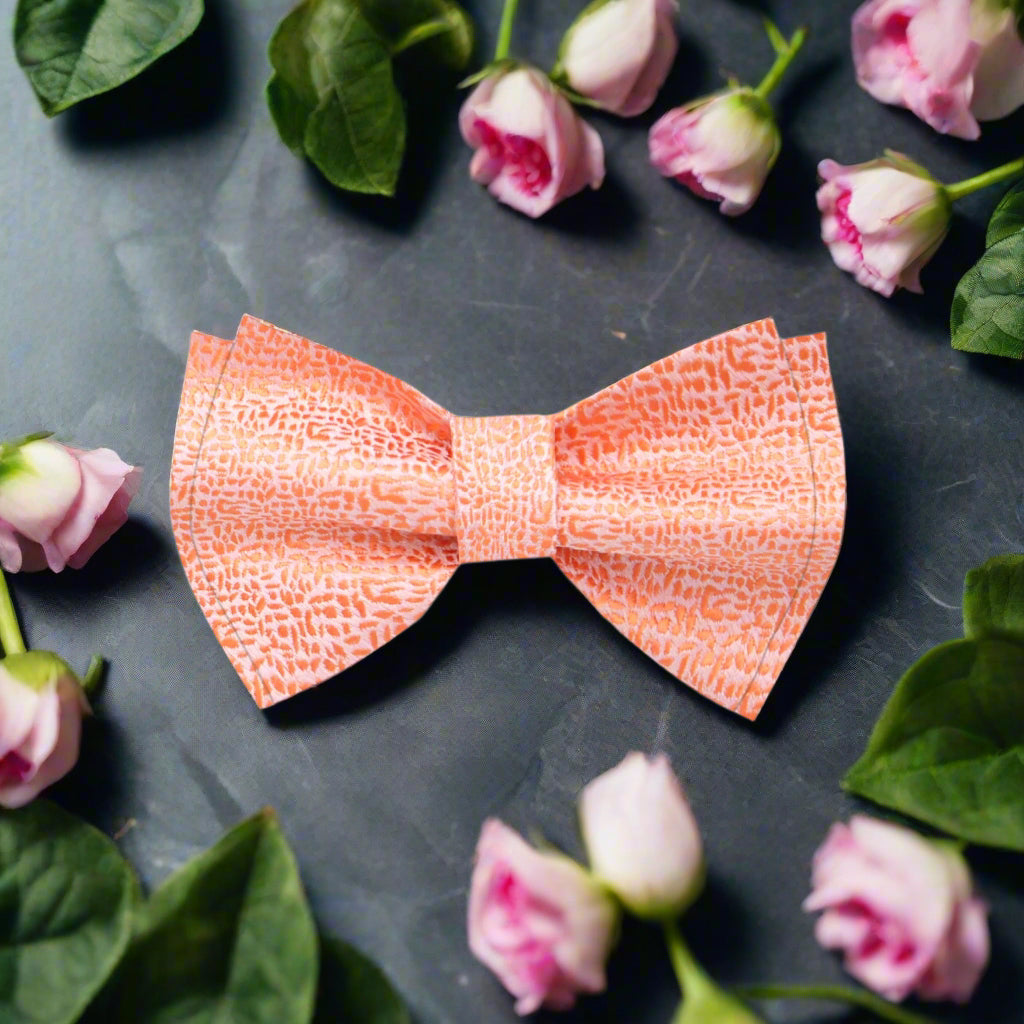 Close-up of a blue textured bow tie, showcasing the intricate design and vibrant color.