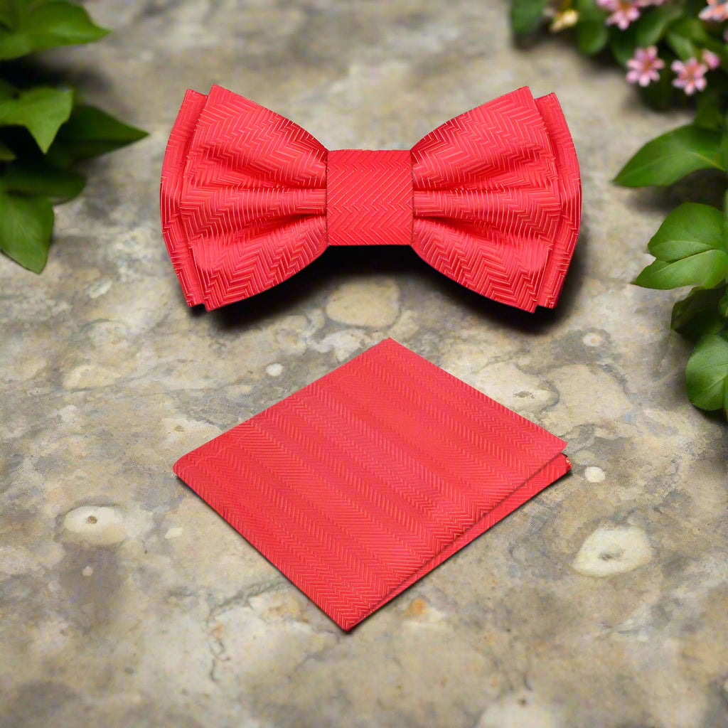 Elegant garnet red silk bow tie displayed on a classic white dress shirt, highlighting the texture and color contrast.