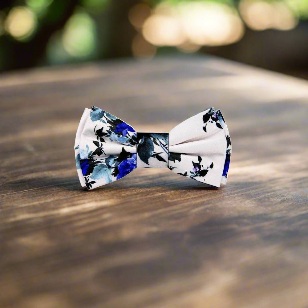 Artistic floral bow tie paired with a white shirt and navy suit for formal events