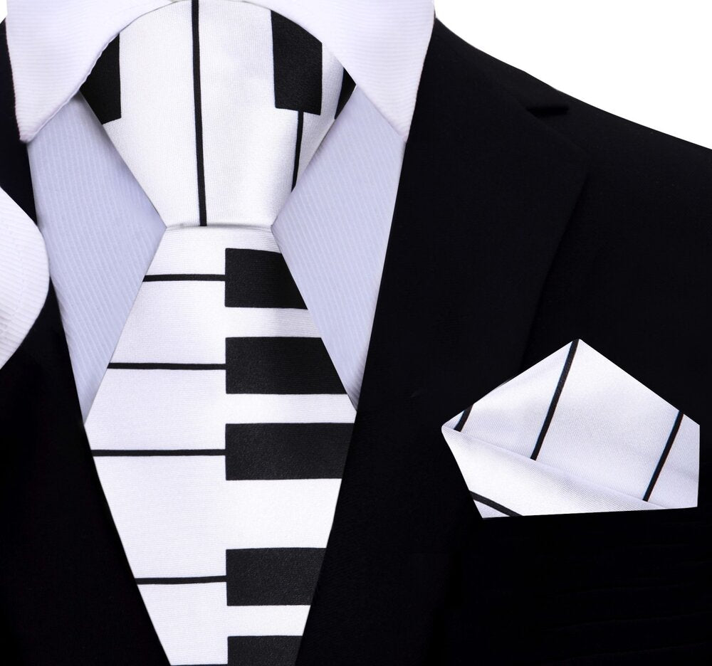 Close-up of the piano pattern on the necktie, showcasing its unique design.