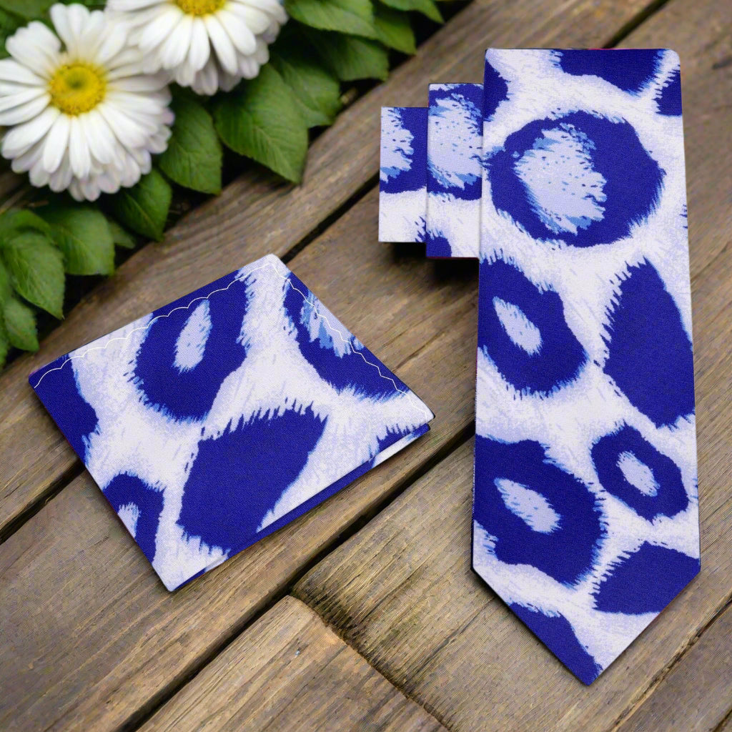 Close-up of Frostwyke silk tie showing blue leopard pattern on white background