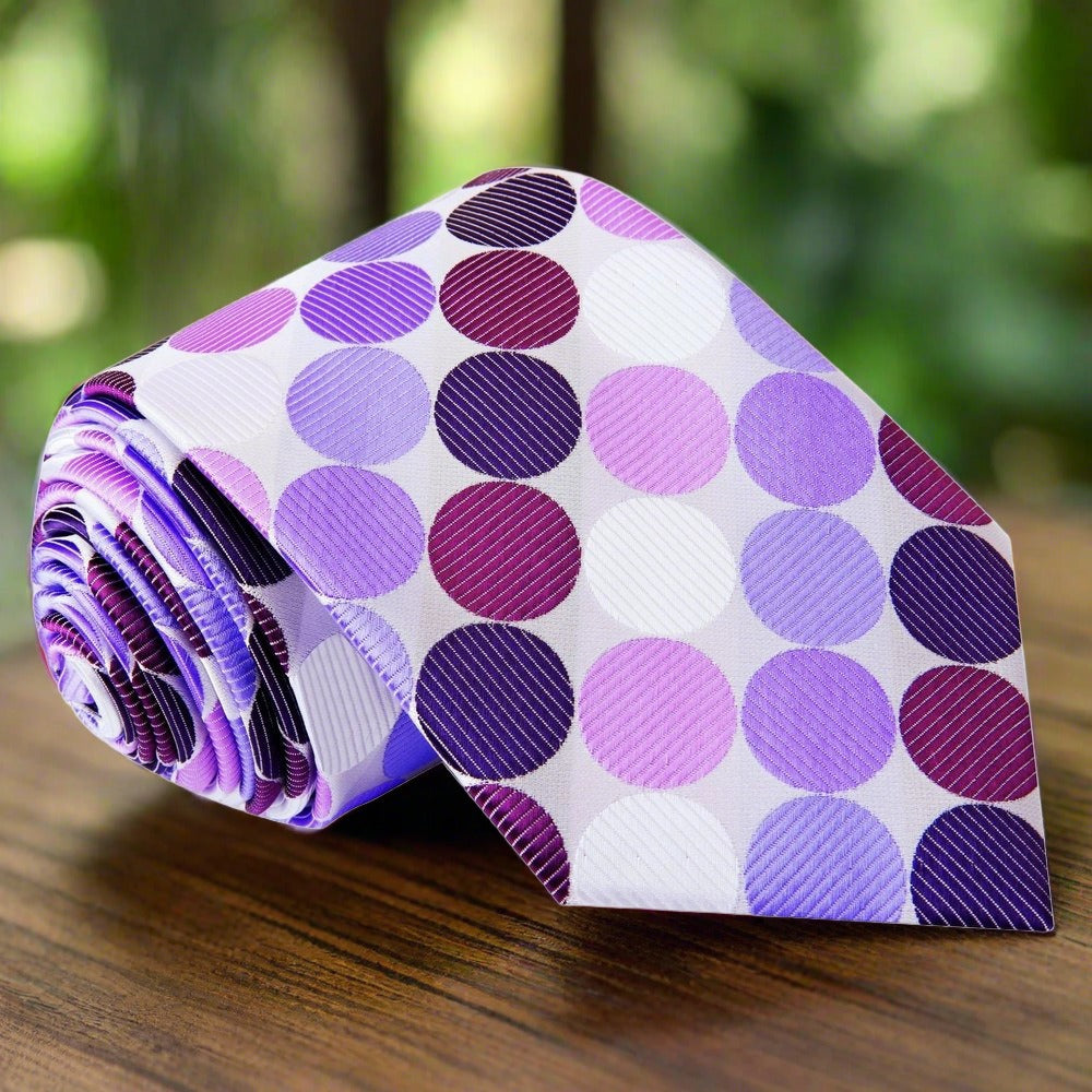 Large polka dot silk necktie in vibrant colors, showcasing the bold pattern against a white shirt.