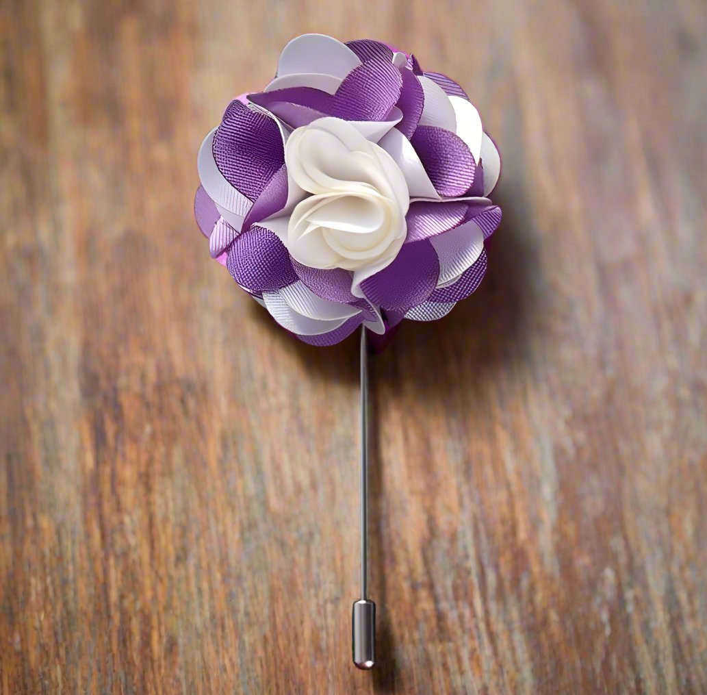 Flat lay of the vibrant leaf lapel pin with various color options displayed alongside