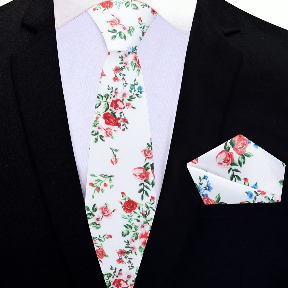 Elegant Floral Silk Necktie styled with a charcoal grey suit, demonstrating its versatility for formal events.