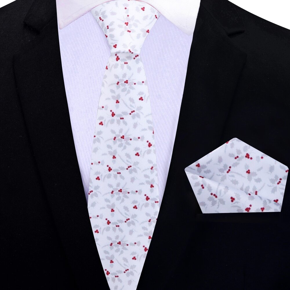 Close-up of the festive holly berry necktie showcasing intricate details.