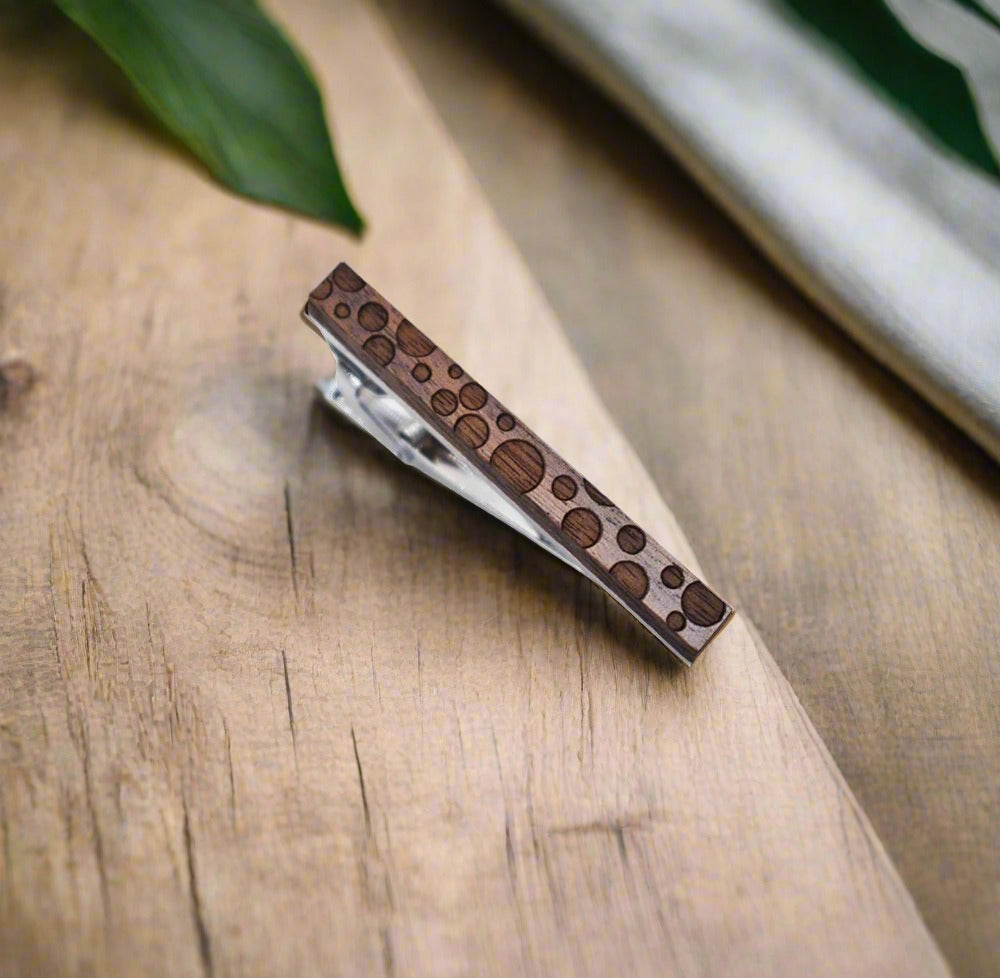 Stylish mens wooden and metal tie clip on a white dress shirt