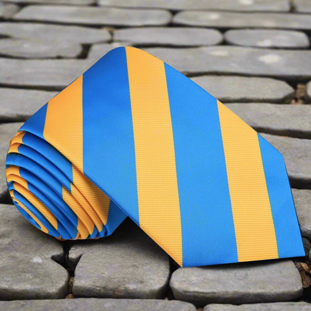 Flat lay of the elegance striped silk tie next to a matching pocket square.