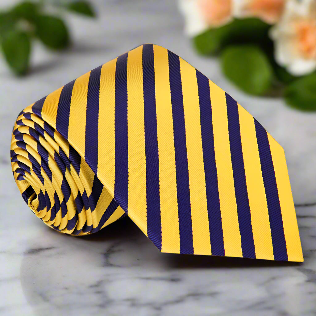 Vibrant yellow and blackened blue stripe silk tie on a model's neck