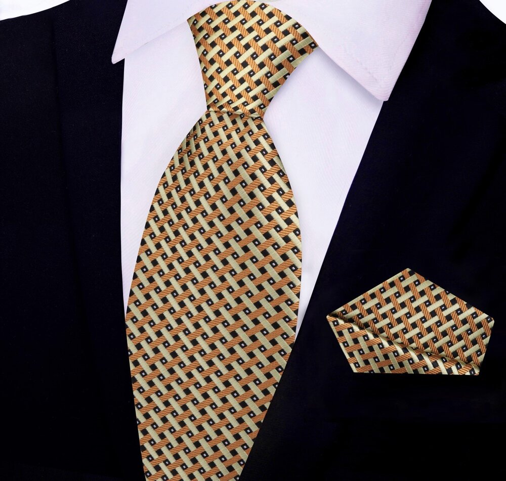 Man wearing a gold silk necktie with a navy suit for a wedding