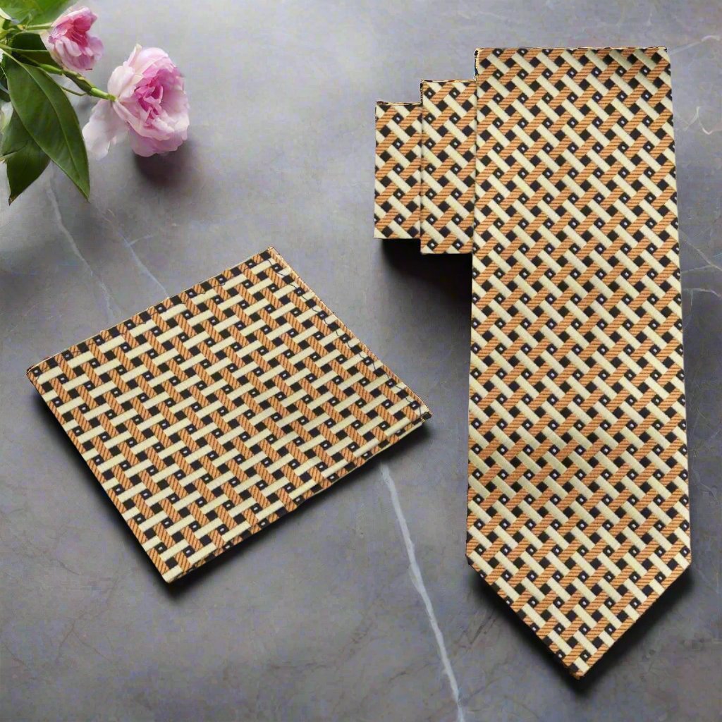 Close-up of gold geometric silk tie on a mannequin showing intricate pattern