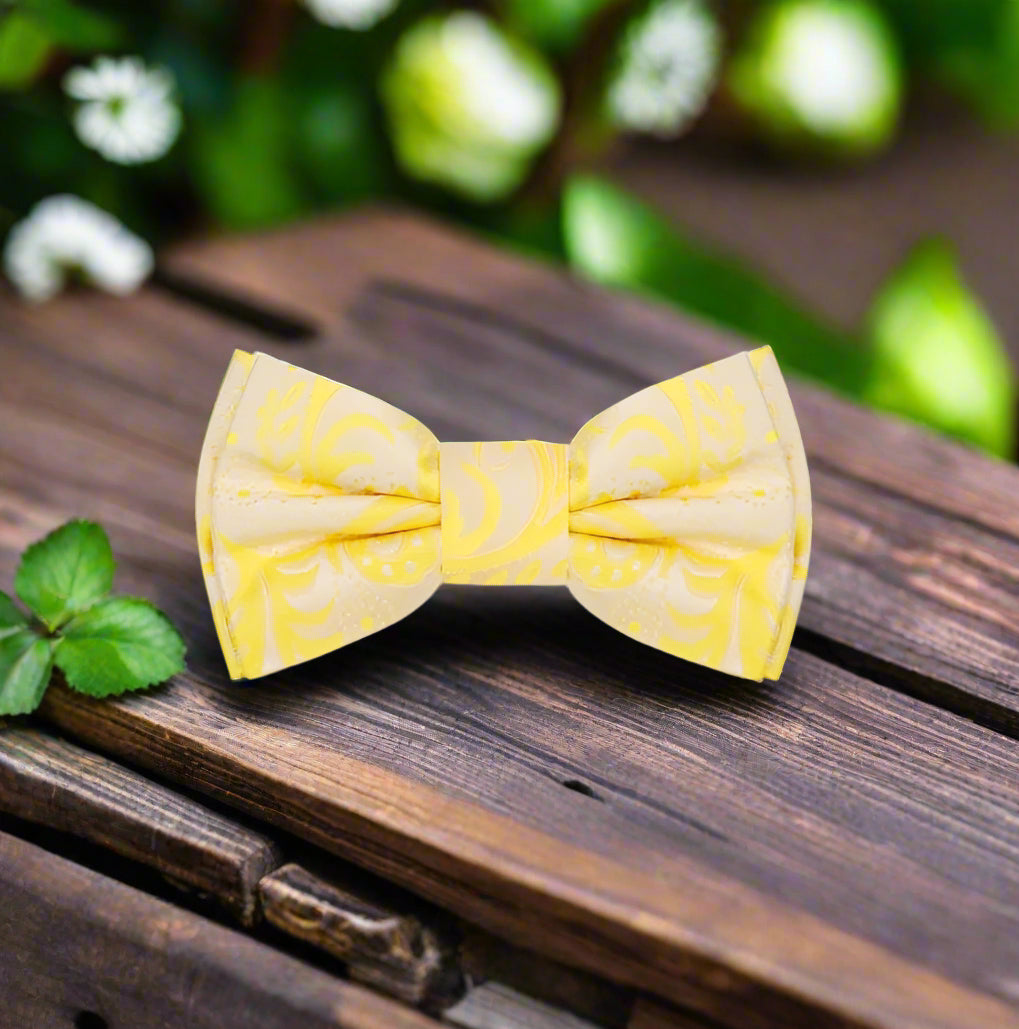 Charming paisley silk bow tie in yellow, perfect for spring weddings.