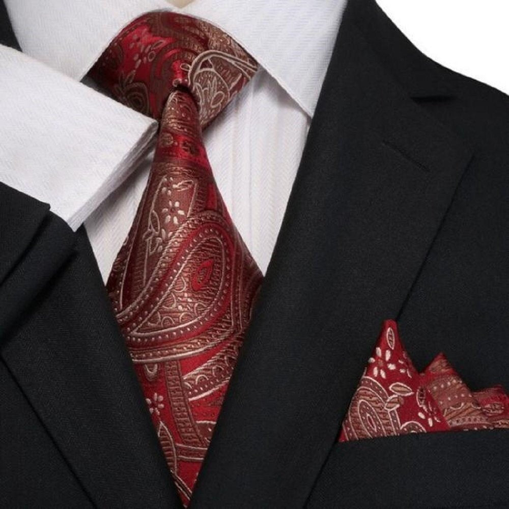 Close-up of kids chestnut silk necktie with paisley pattern