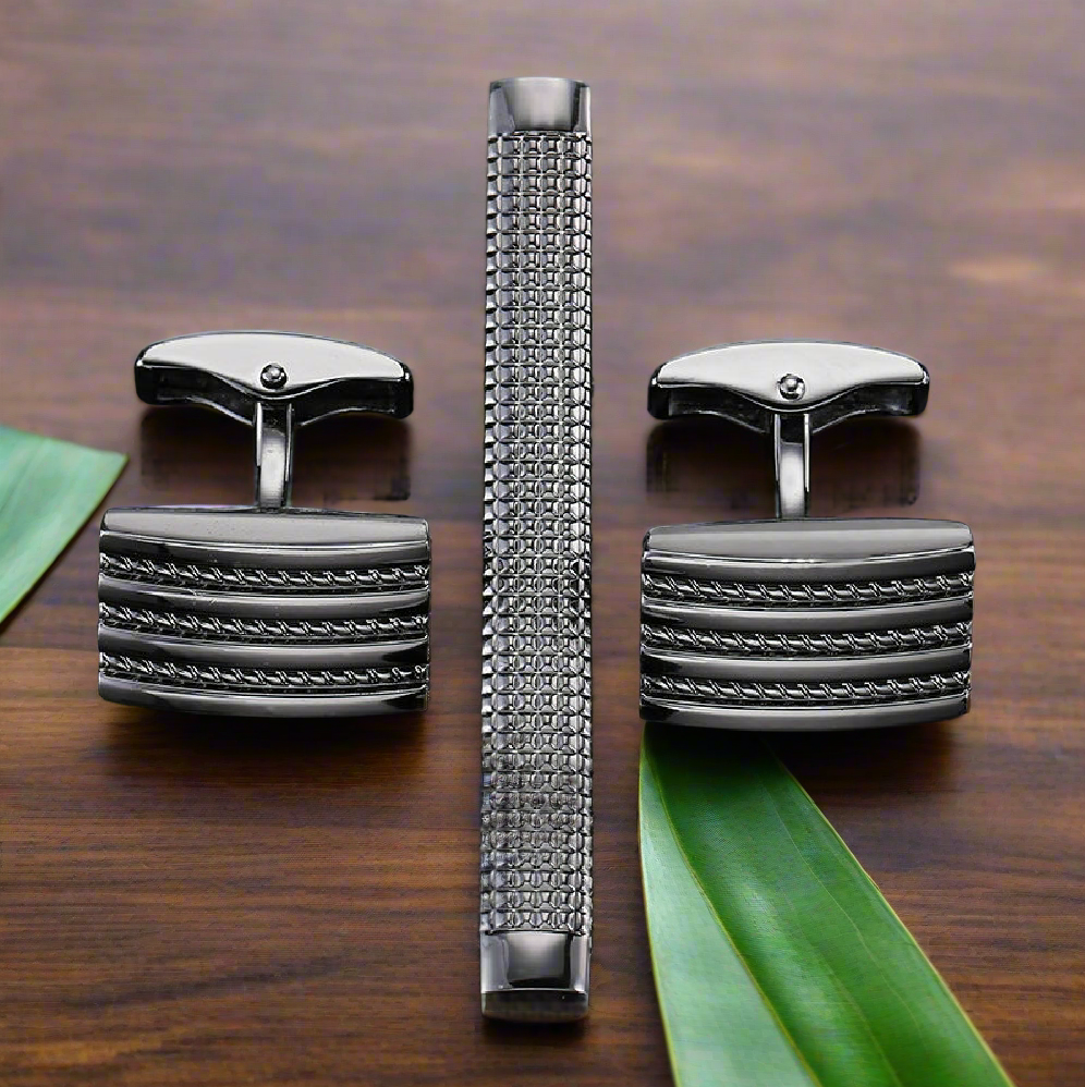 Dark chrome rope tie bar and cufflinks set on a dress shirt for formal wear