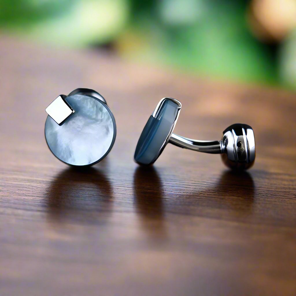 Elegant iridescent pearl cufflinks on a white shirt cuff showcasing their shine