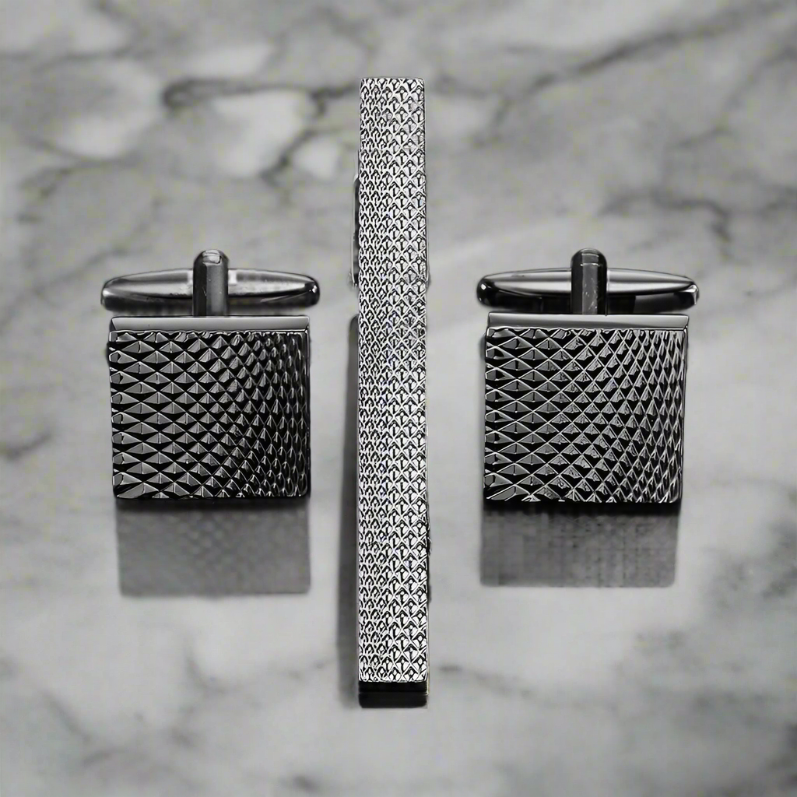 Close-up of men's silver textured cufflinks with chrome finish