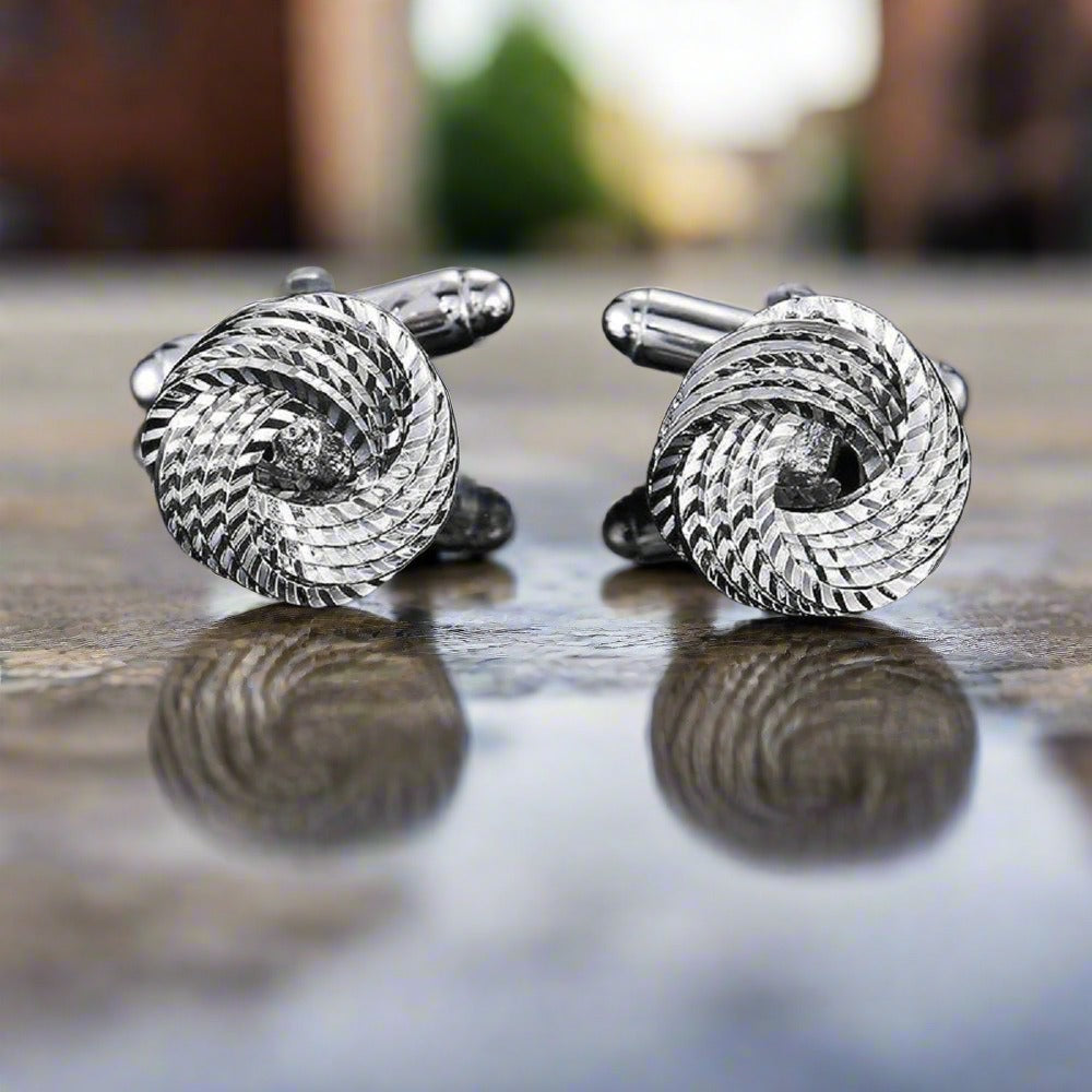Close-up view of the circular knot shape of the Elegant Knot Cufflinks.