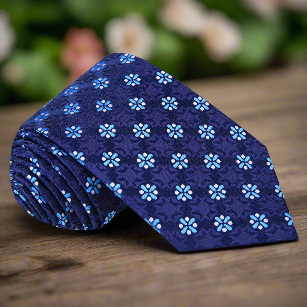 Elegant dark blue silk necktie with light blue medallions, ideal for weddings